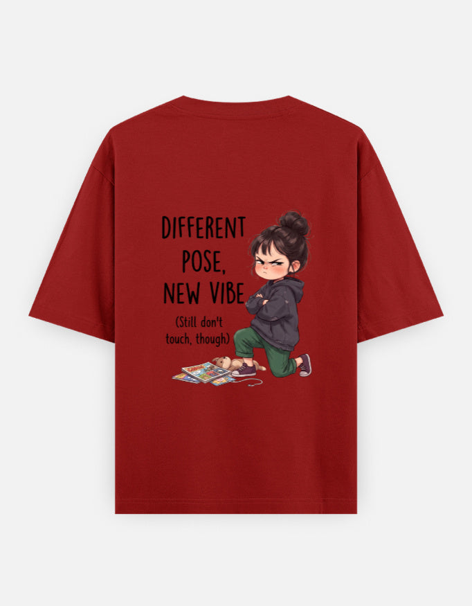 Red unisex oversized round-neck T-shirt, back graphic: child and 'Different Pose, New Vibe'.
