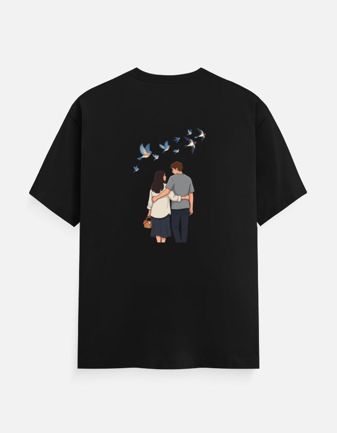 Black unisex crewneck T-shirt with printed couple and birds graphic on front