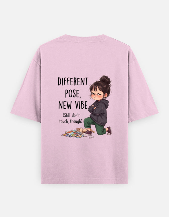 Light baby pink unisex oversized round-neck T-shirt, back graphic: child and 'Different Pose, New Vibe'.