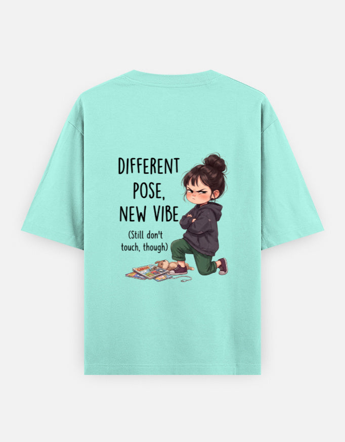 Mint unisex oversized round-neck T-shirt, back graphic: child and 'Different Pose, New Vibe'.