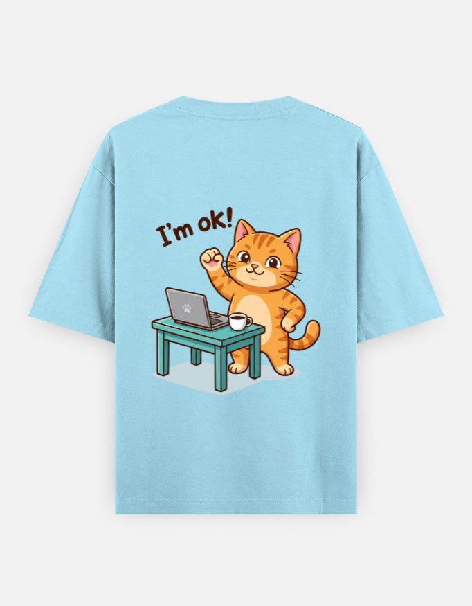 Baby blue oversized round-neck T-shirt with “I’m ok!” orange cat desk graphic