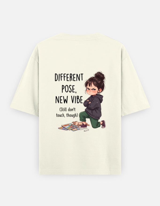 Off-white unisex oversized round-neck T-shirt, back graphic: child and 'Different Pose, New Vibe'.