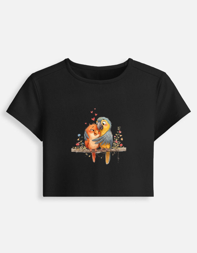 Women’s black fitted crop baby tee with colorful bird graphic on the front