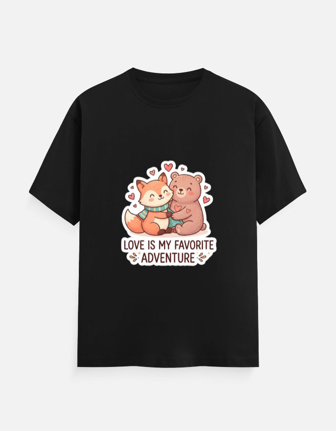 Unisex crew neck T-shirt in black with cartoon bear graphic, hearts, and 'Love is my favorite adventure'
