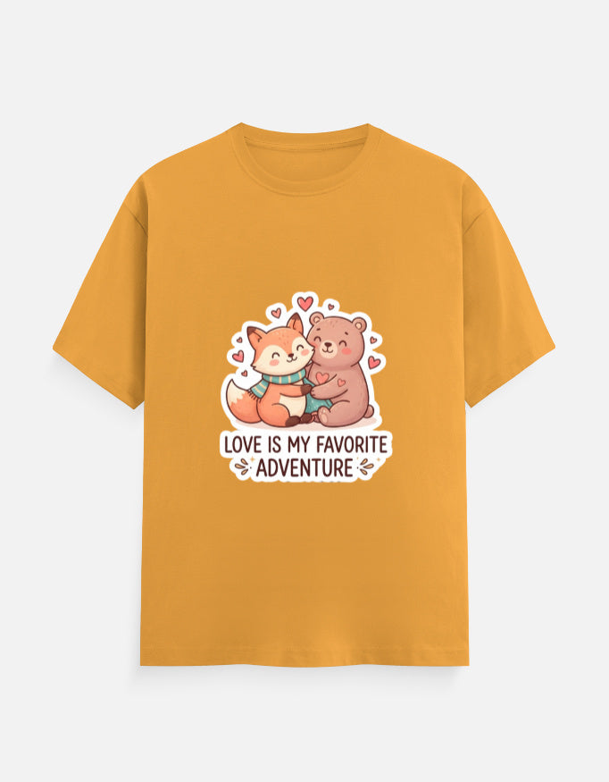 Unisex crew neck T-shirt in gold with cartoon bear graphic, hearts, and 'Love is my favorite adventure'