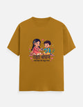 Unisex crew neck T-shirt in mustard yellow with front cartoon couple graphic and text.