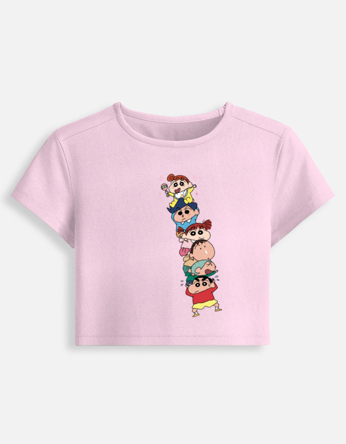 Women’s fitted crop baby tee, light baby pink, front graphic of stacked cartoon kids