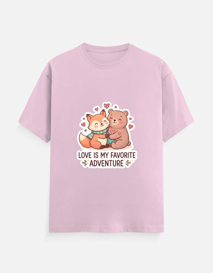 Unisex crew neck T-shirt in light pink with cartoon bear graphic, hearts, and 'Love is my favorite adventure'