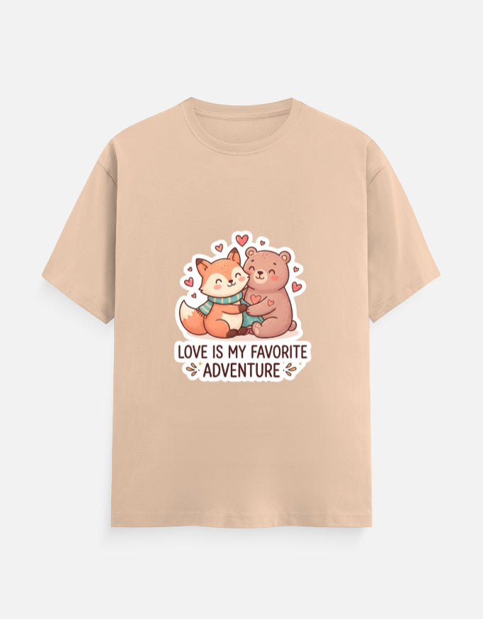Unisex crew neck T-shirt in beige with cartoon bear graphic, hearts, and 'Love is my favorite adventure'
