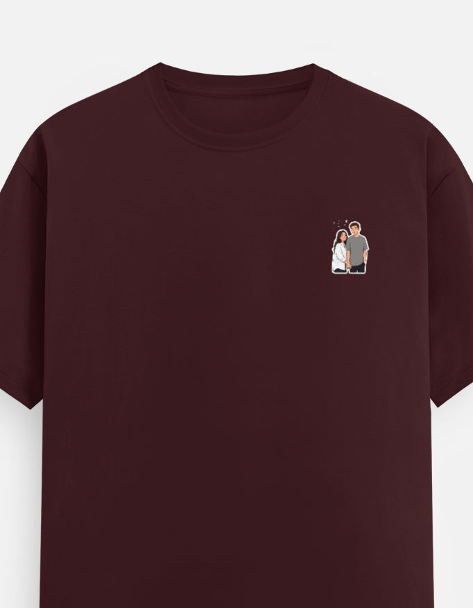 Maroon unisex crew-neck T-shirt with short sleeves and small chest graphic.