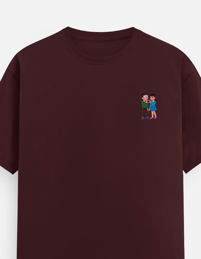 Maroon unisex crew-neck T-shirt with small colorful couple graphic on chest