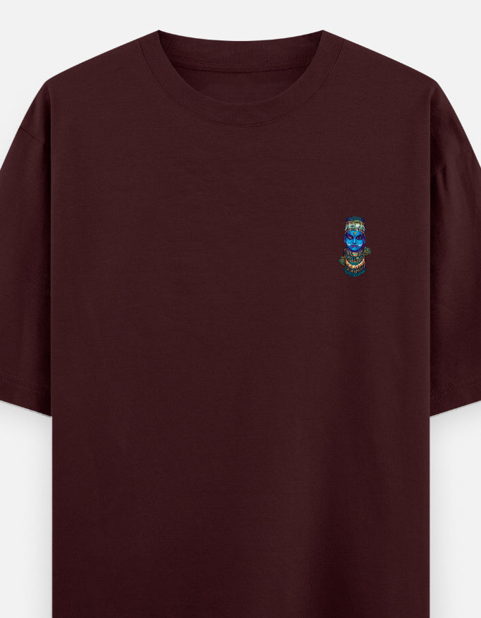 Maroon unisex oversized round-neck T-shirt with small colorful face graphic on chest