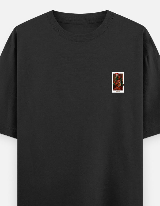Black oversized unisex round-neck T-shirt with small deity portrait graphic at chest