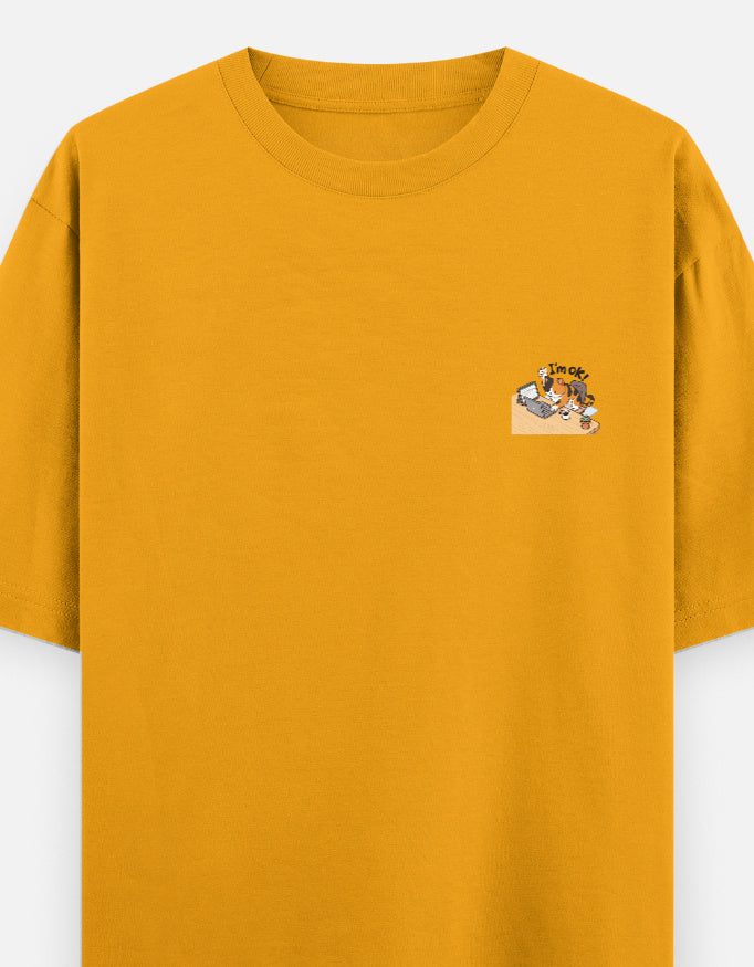 Golden yellow unisex oversized round-neck T-shirt with small chest graphic.