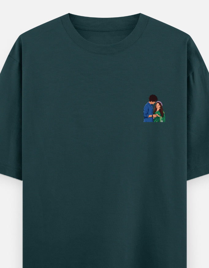 Unisex oversized crewneck T-shirt, petrol blue, with small couple graphic on chest.