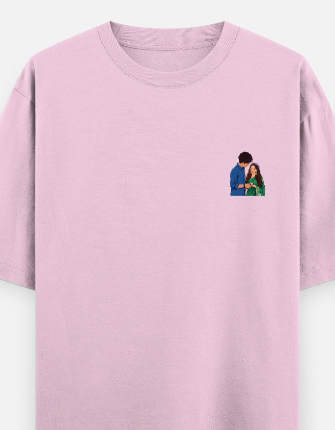 Unisex oversized crewneck T-shirt, light baby pink, with small couple graphic on chest.
