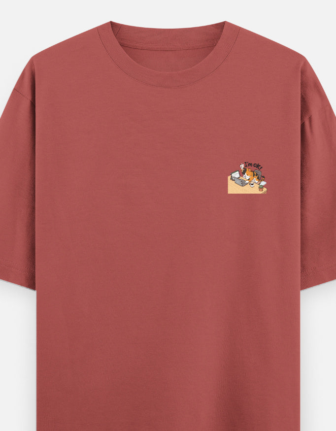 Coral red unisex oversized round-neck T-shirt with small chest graphic.
