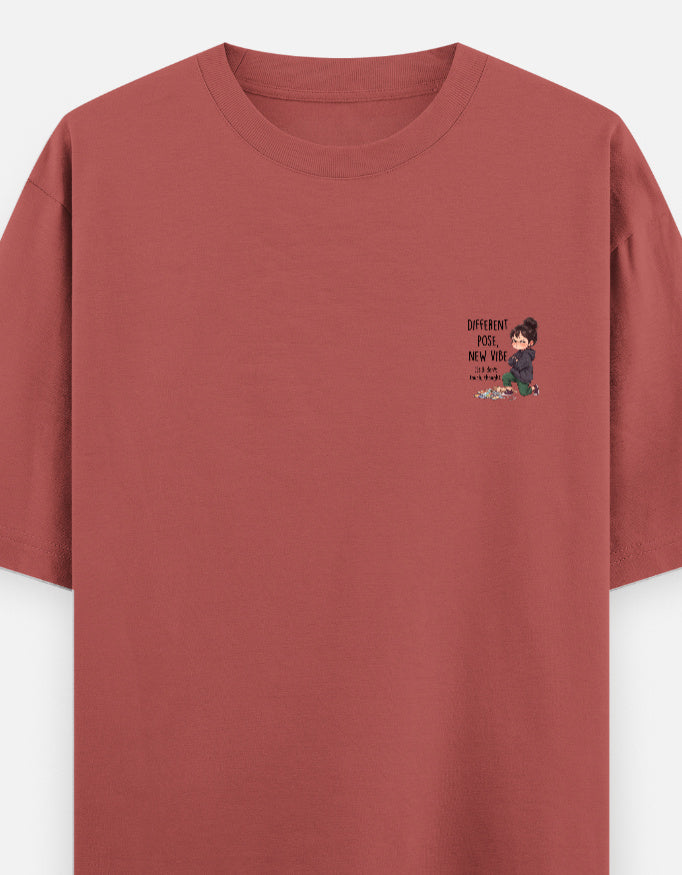 Unisex graphic oversized round-neck T-shirt in coral with small chest print.