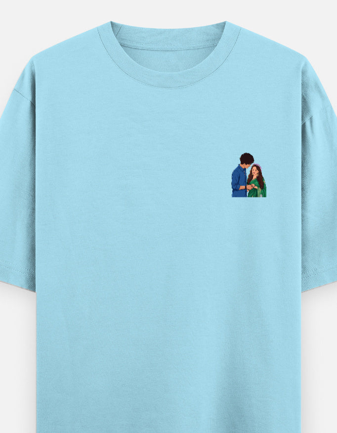 Unisex oversized crewneck T-shirt, baby blue, with small couple graphic on chest.