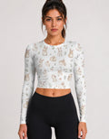 Women's white long-sleeve crop top with all-over cute animal face print, crew neck.